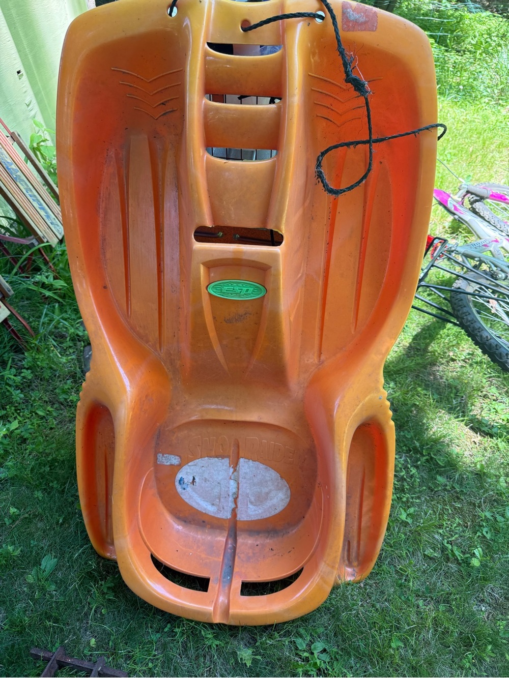 Orange Plastic Snow/Grass Sled  it's for the winter snow it's for kids
